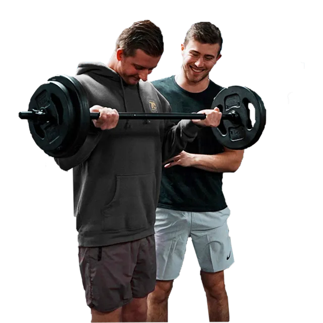 Devon coaching a client through a barbell curl